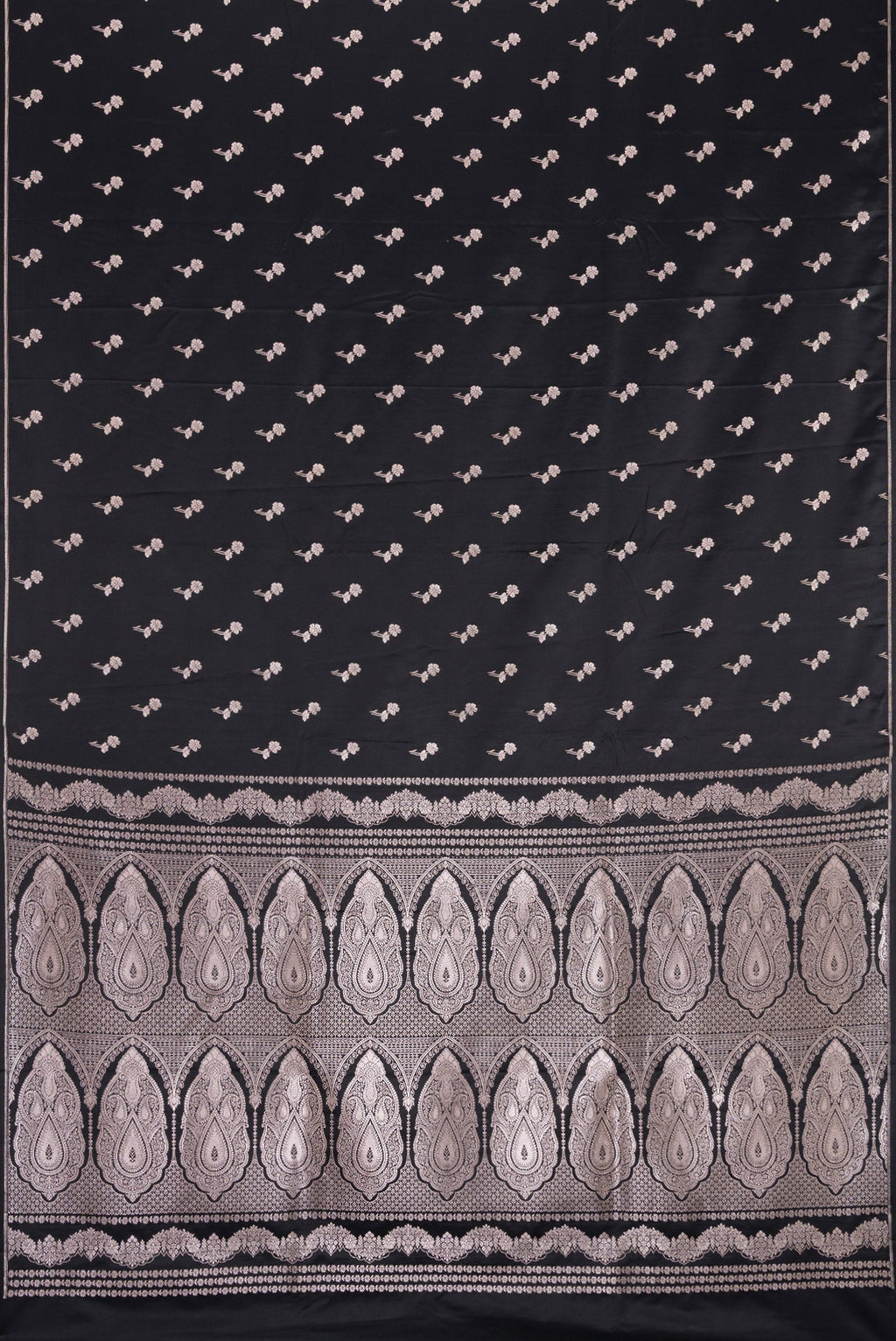 Flat view of Black Dual Tone Blended Banarasi Silk Saree with Zari Butta on the body and Thin Zari Line. 