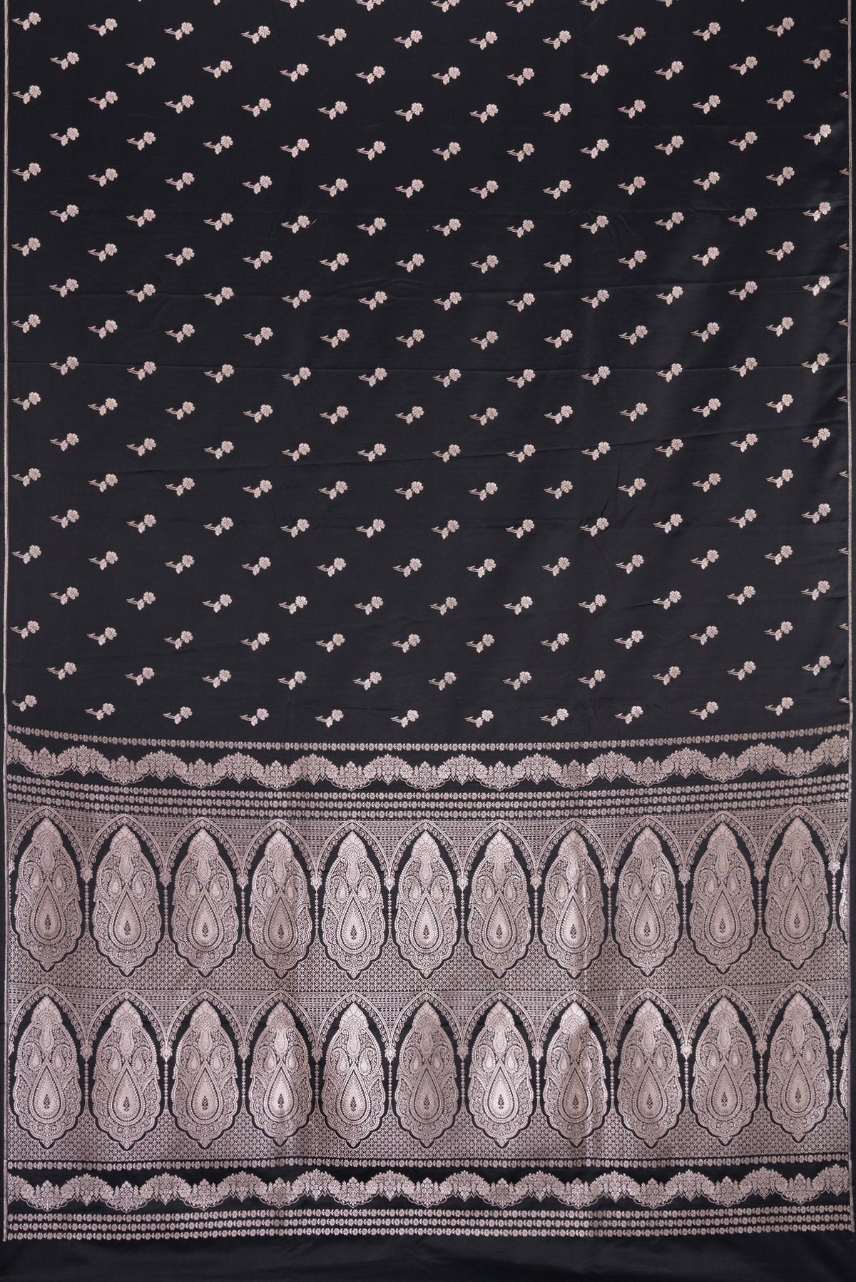 Flat view of Black Dual Tone Blended Banarasi Silk Saree with Zari Butta on the body and Thin Zari Line. 