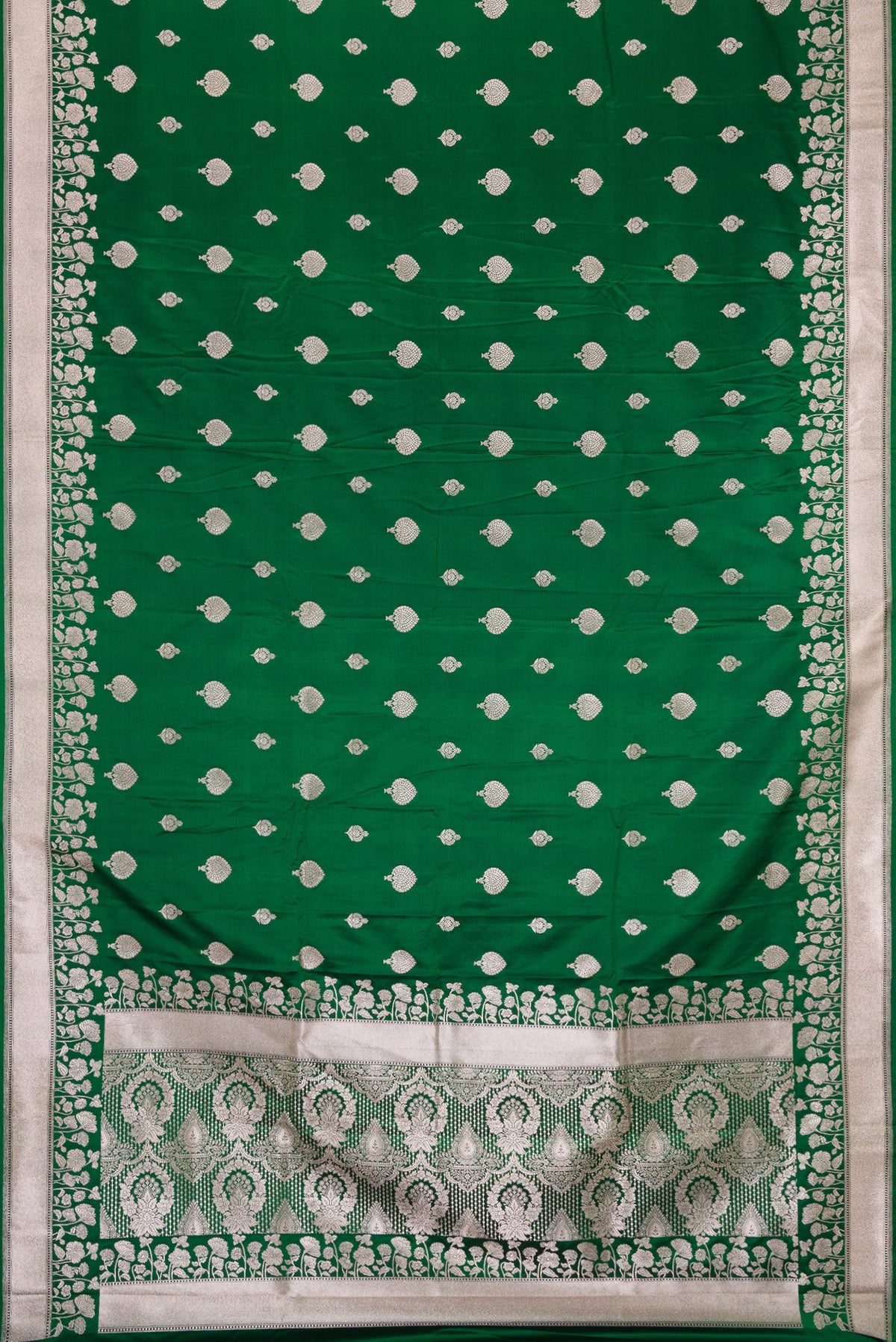 Flat view of Green Dual Tone Blended Banarasi Silk Saree with Zari Butta on the body and Zari Border. 