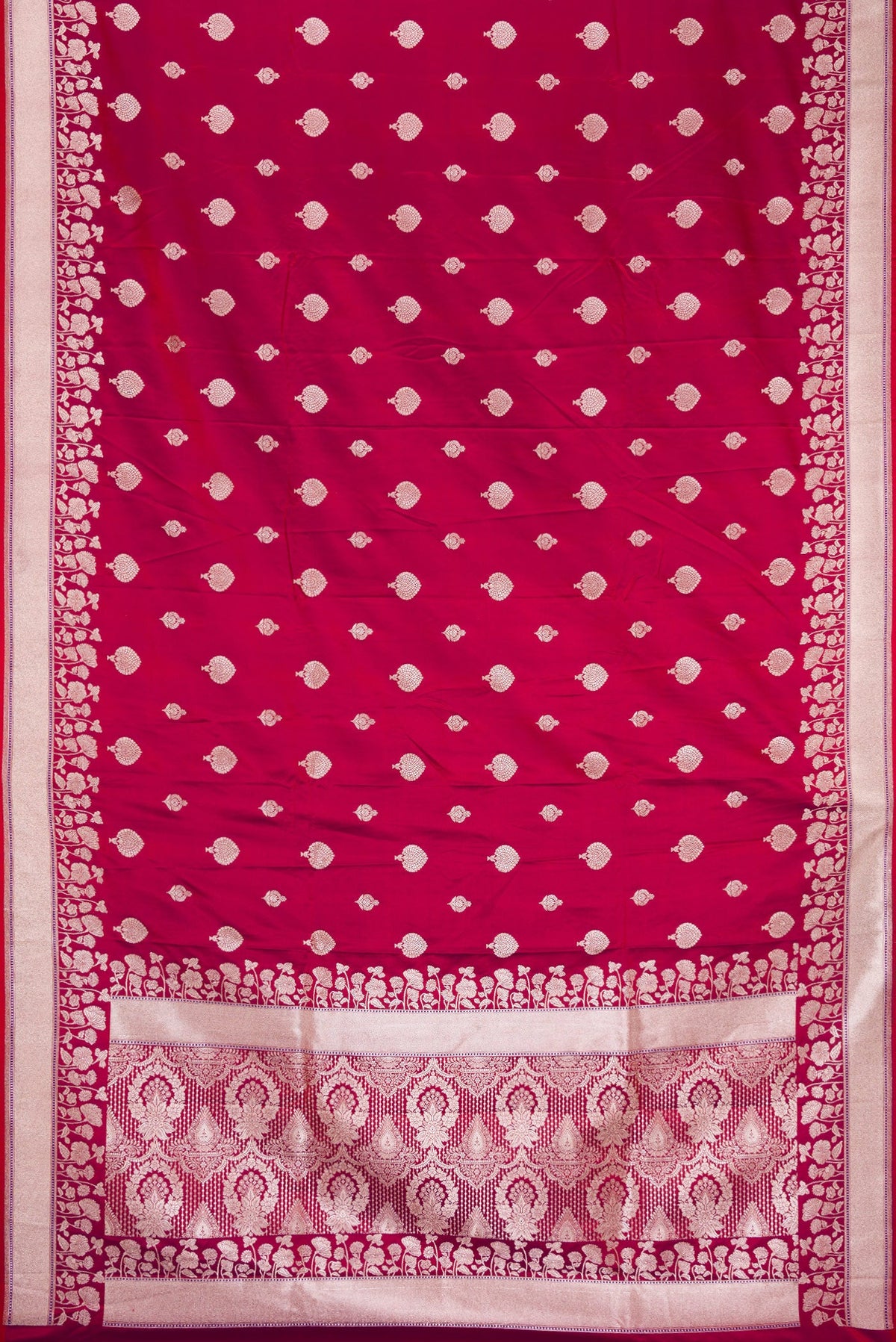Flat view of Maroon Dual Tone Blended Banarasi Silk Saree with Zari Butta on the body and Zari Border. 