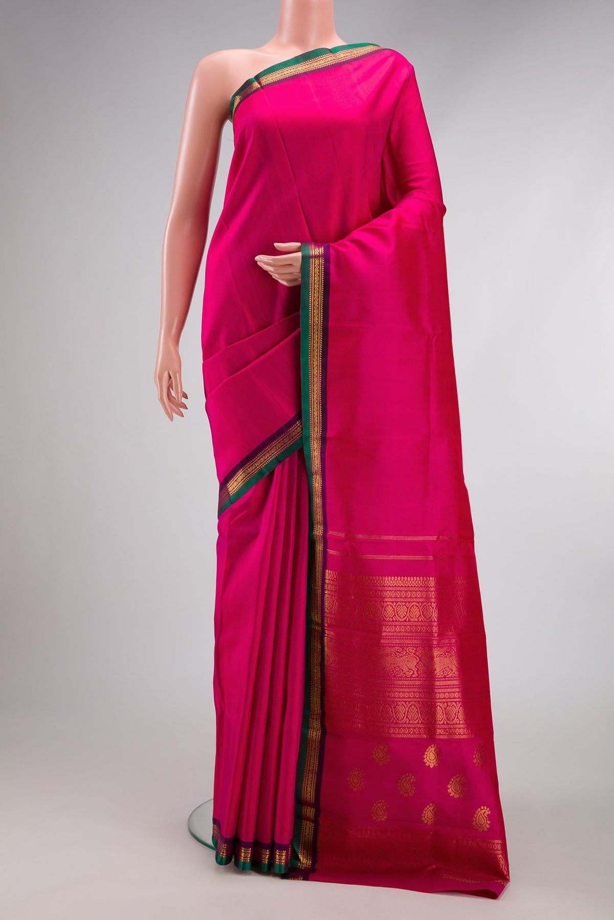 Pink Kanjivaram Silk Saree with Plain Body and Zari Border.  displayed on a mannequin