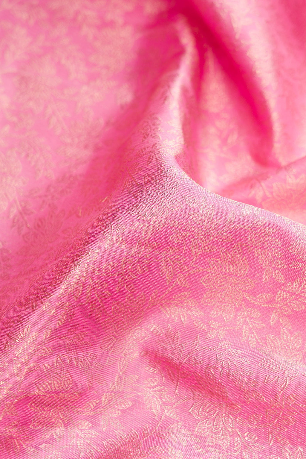 Close up of Pink Dual Tone Kanchipuram Silk Saree with Zari Brocade on the body and Zari Border.  displaying folds