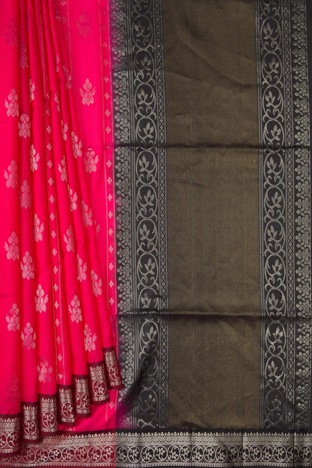 Pleats and pallu of Pink Soft Silk Saree with Zari Butta on the body and Zari Border. 