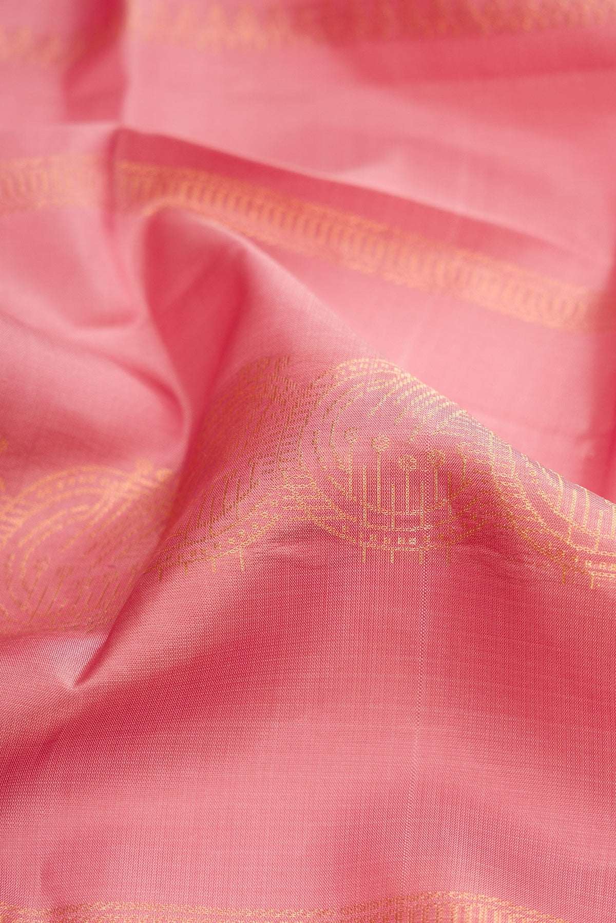Close up of Rose Gold Dual Tone Soft Silk Saree with Stripes on the body and Without Border.  displaying folds