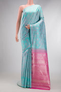 Light Blue Dual Tone Kanjivaram Silk Saree with Jacquard design on the body and Fancy Border.  displayed on a mannequin