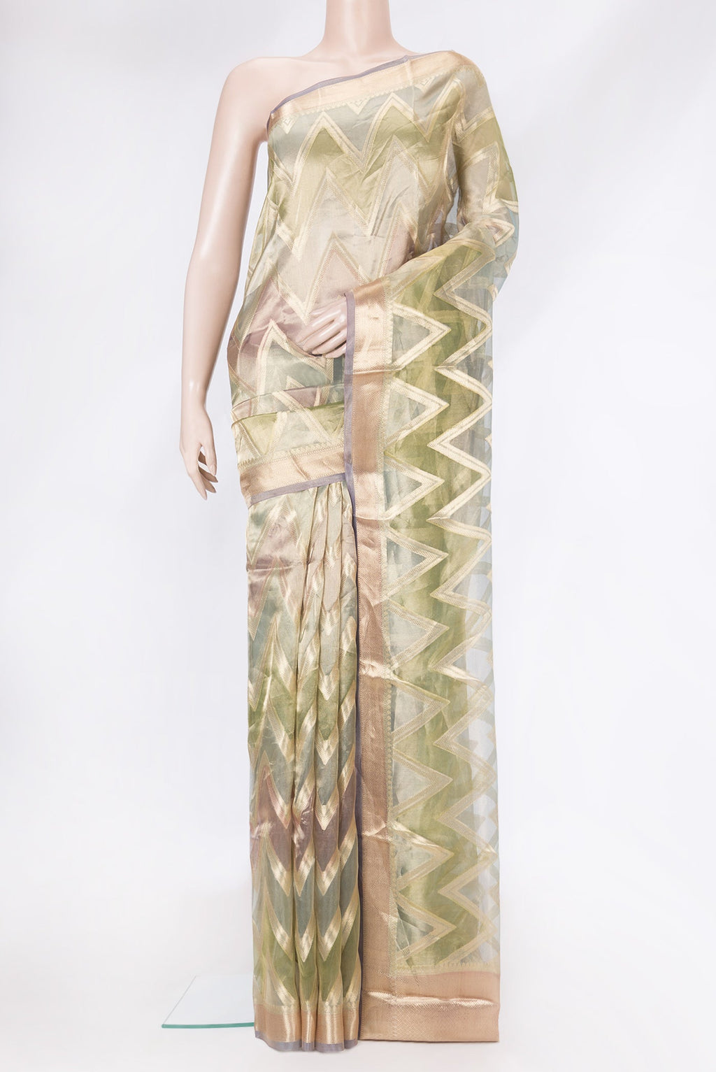 Green Dual Tone Organza Silk Saree with Zari Brocade on the body and Zari Border.  displayed on a mannequin