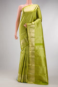 Parrot Green Dual Tone Kanchipuram Silk Saree with Zari Brocade on the body and Zari Border.  displayed on a mannequin