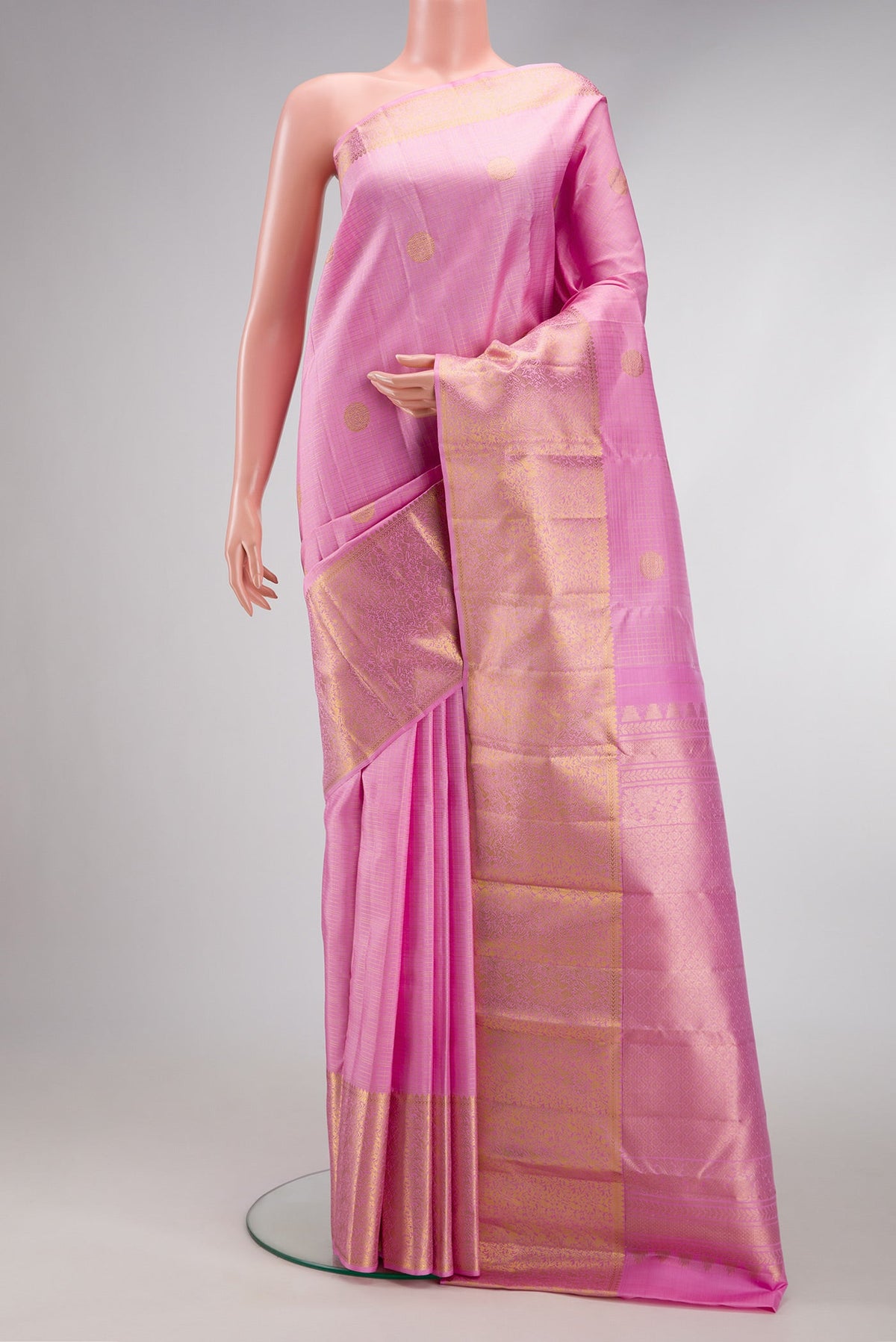Pink Dual Tone Kanjivaram Silk Saree with Checked design on the body and Zari Border.  displayed on a mannequin