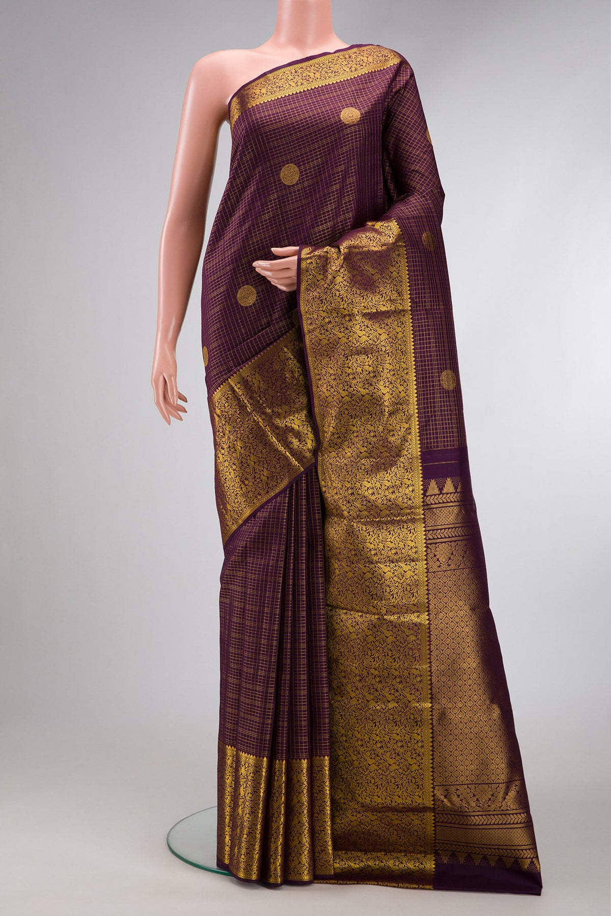 Burgundy Dual Tone Kanjivaram Silk Saree with Stripes on the body and Zari Border.  displayed on a mannequin