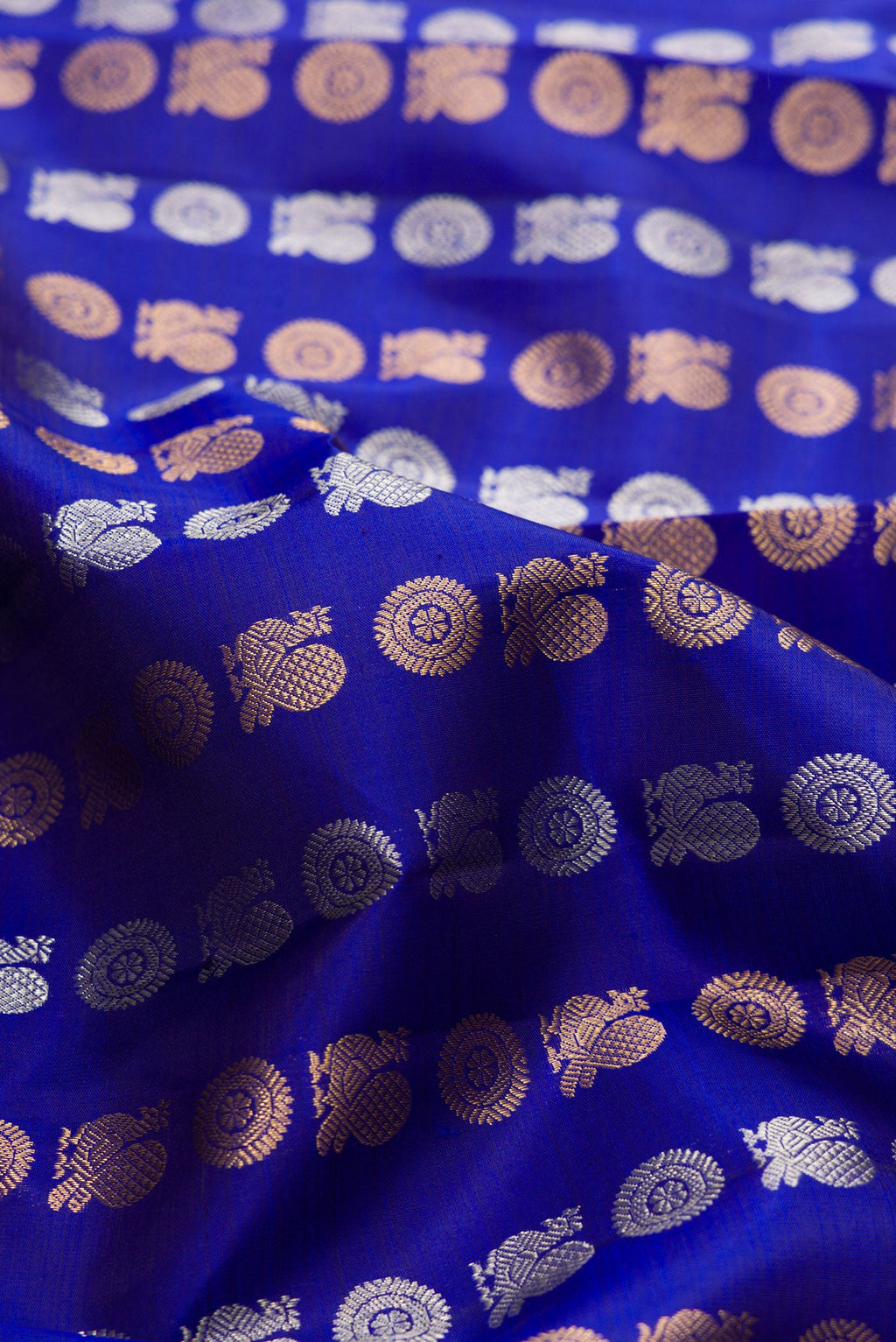 Close up of Navy Blue Dual Tone Kanjivaram Silk Saree with Zari Butta on the body and Zari Border.  displaying folds
