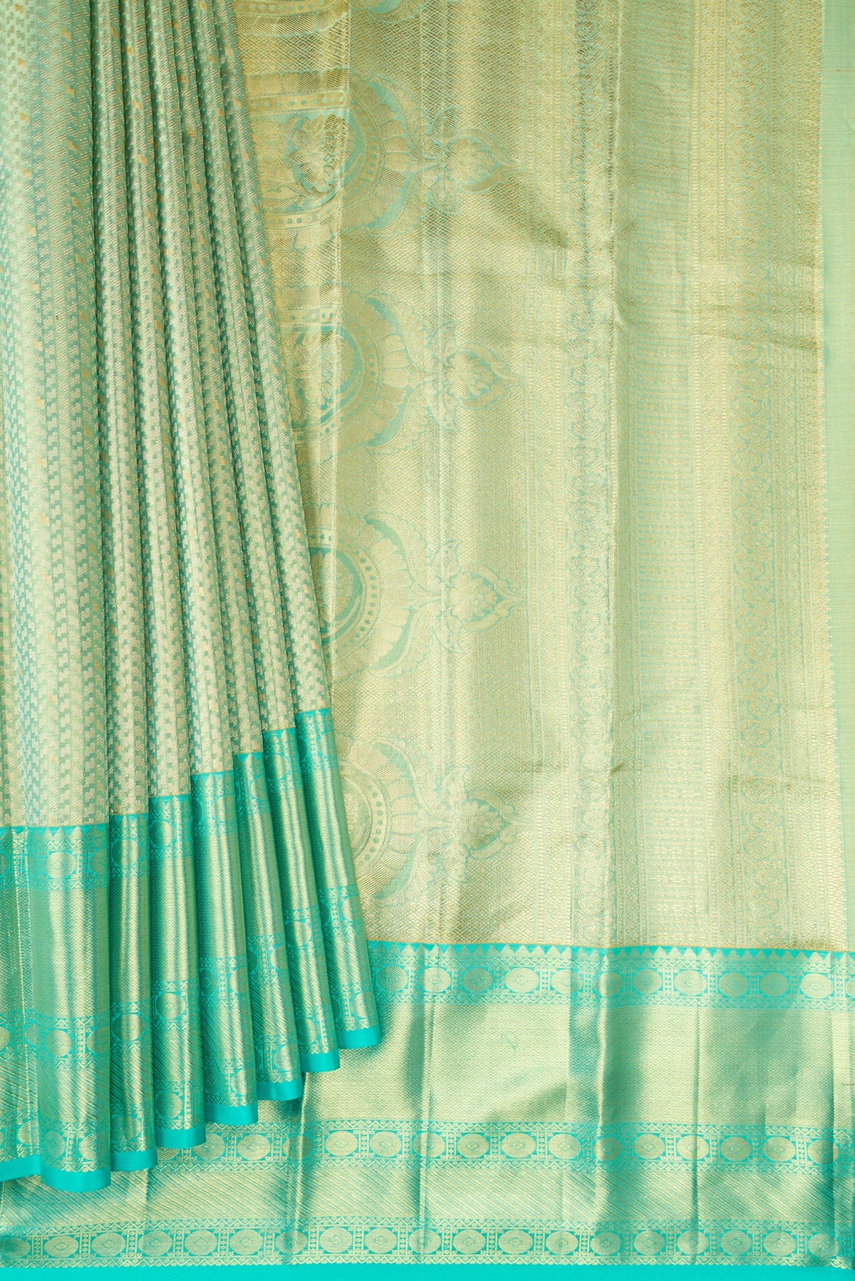 Pleats and pallu of Light Green Dual Tone Kanchipuram Tissue Silk Saree with Zari Brocade on the body and Zari Border. 