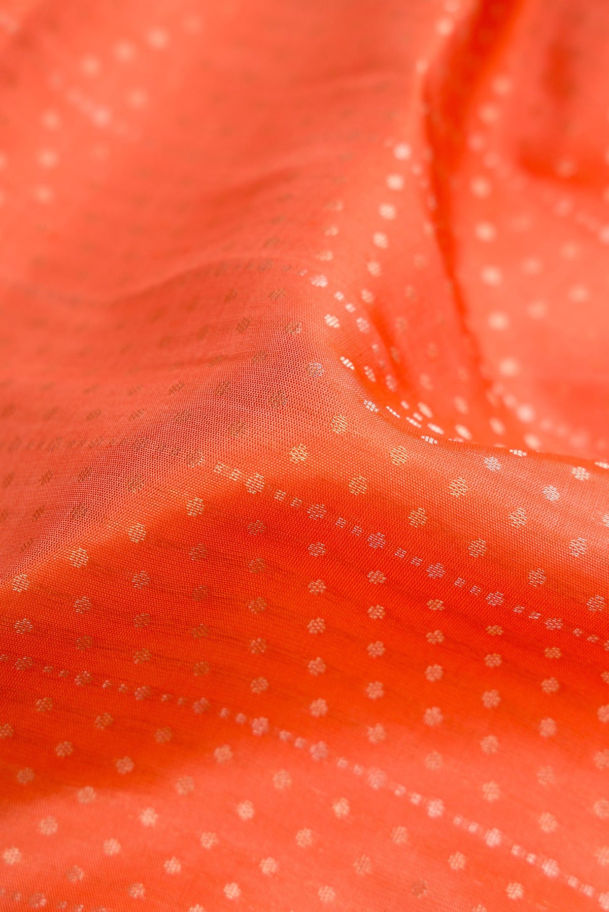 Close up of Beige and Off White Dual Tone Soft Silk Saree with Zari Brocade on the body and Fancy Border.  displaying folds