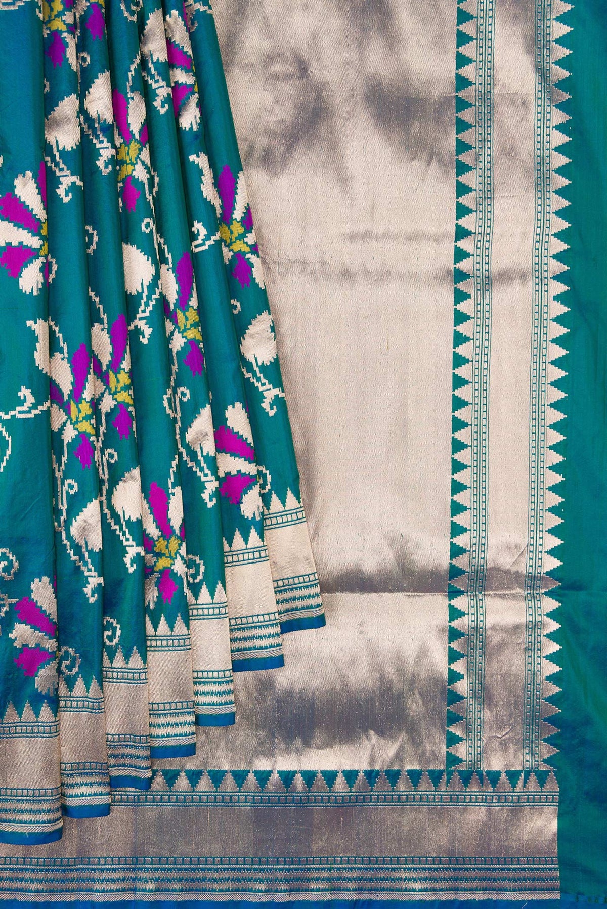 Pleats and pallu of Peacock Blue Dual Tone Banarasi Silk Saree with Zari Butta on the body and Zari Border. 