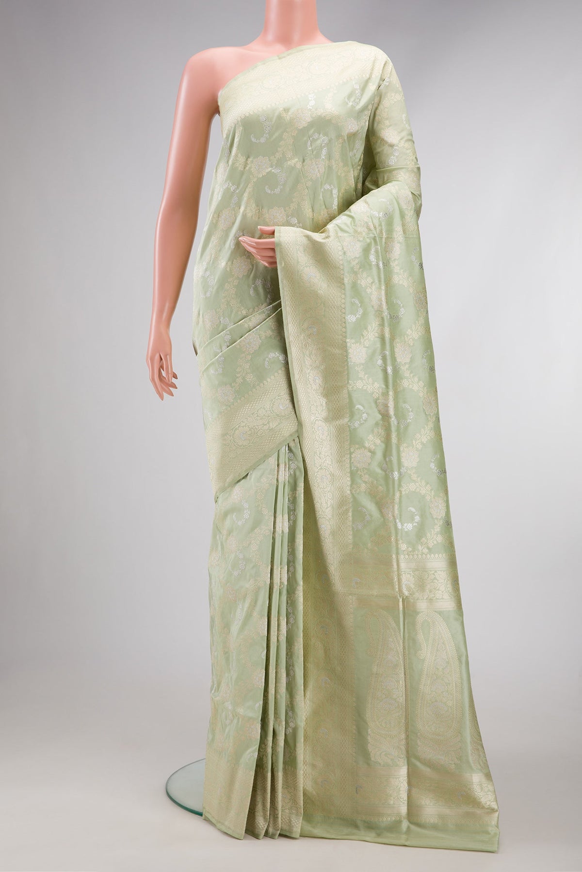 Pista Green Dual Tone Banarasi Silk Saree with Zari Brocade on the body and Zari Border.  displayed on a mannequin