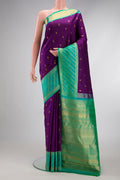 Purple Dual Tone Kanjivaram Silk Saree with Zari Butta on the body and Zari Border.  displayed on a mannequin