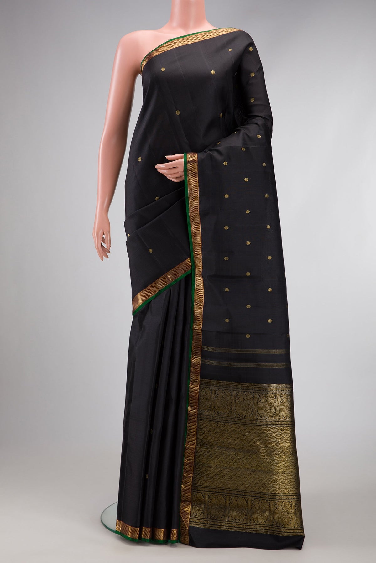 Pure Silk Pure Zari Black Dual Tone Kanchipuram Saree with Zari Butta on the body and Zari Border.  displayed on a mannequin