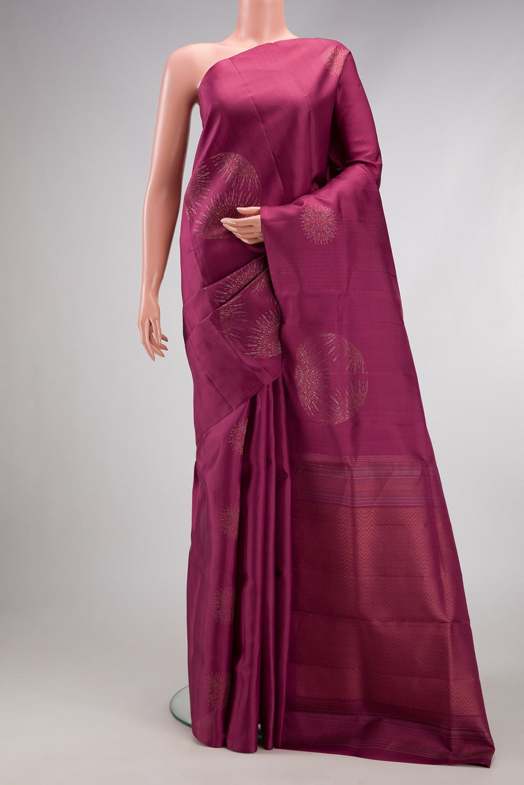 Mauve Soft Silk Saree with Zari Butta on the body and Without Border.  displayed on a mannequin