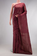Dark Mauve Soft Silk Saree with Zari Butta on the body and Without Border.  displayed on a mannequin