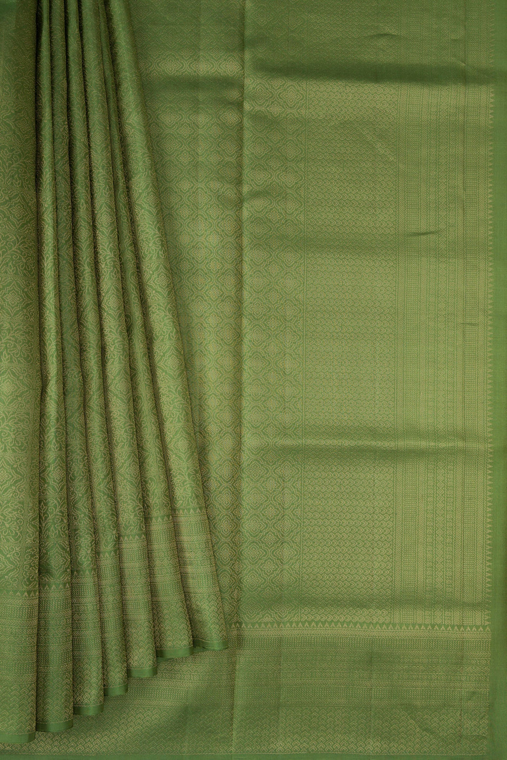 Pleats and pallu of Green Soft Silk Saree with Zari Brocade on the body and Fancy Border. 