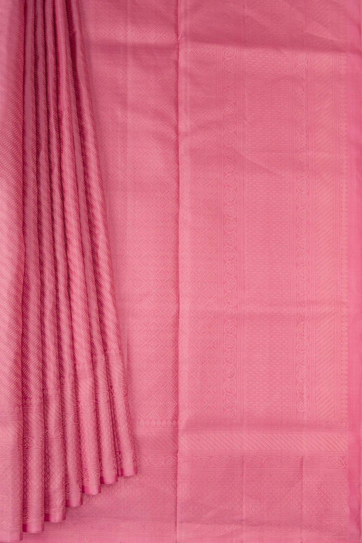 Pleats and pallu of Rose pink Soft Silk Saree with Zari Brocade on the body and Fancy Border. 