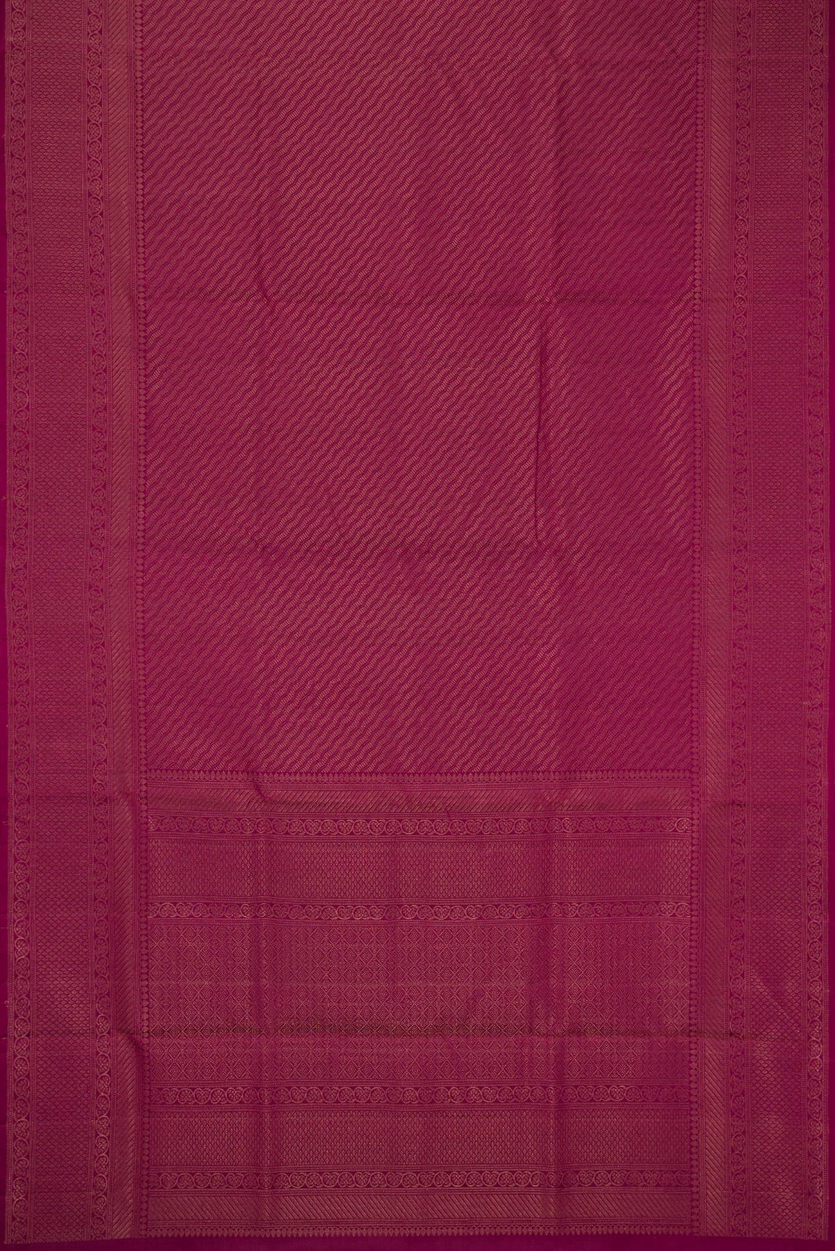 Flat view of Magenta Soft Silk Saree with Zari Brocade on the body and Fancy Border. 