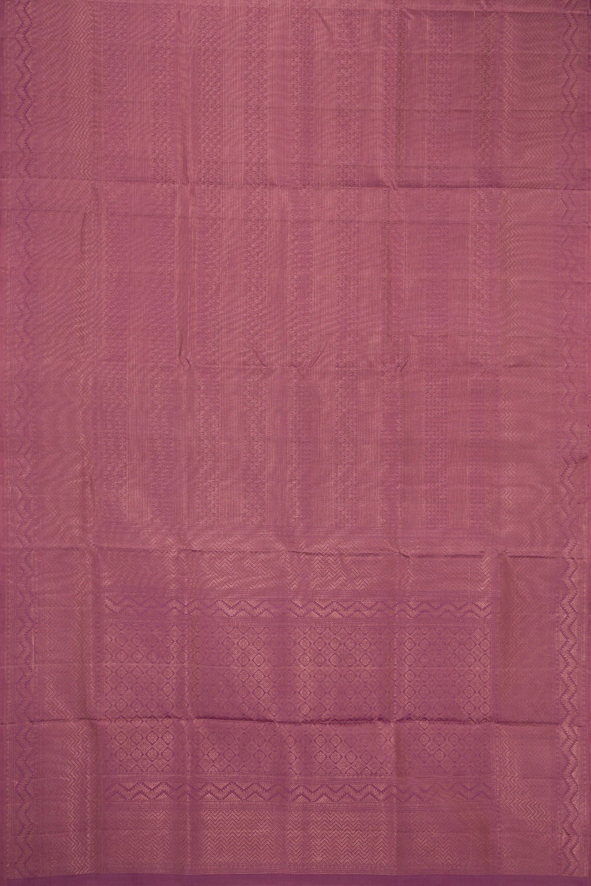 Flat view of Purple Soft Silk Saree with Zari Brocade on the body and Fancy Border. 