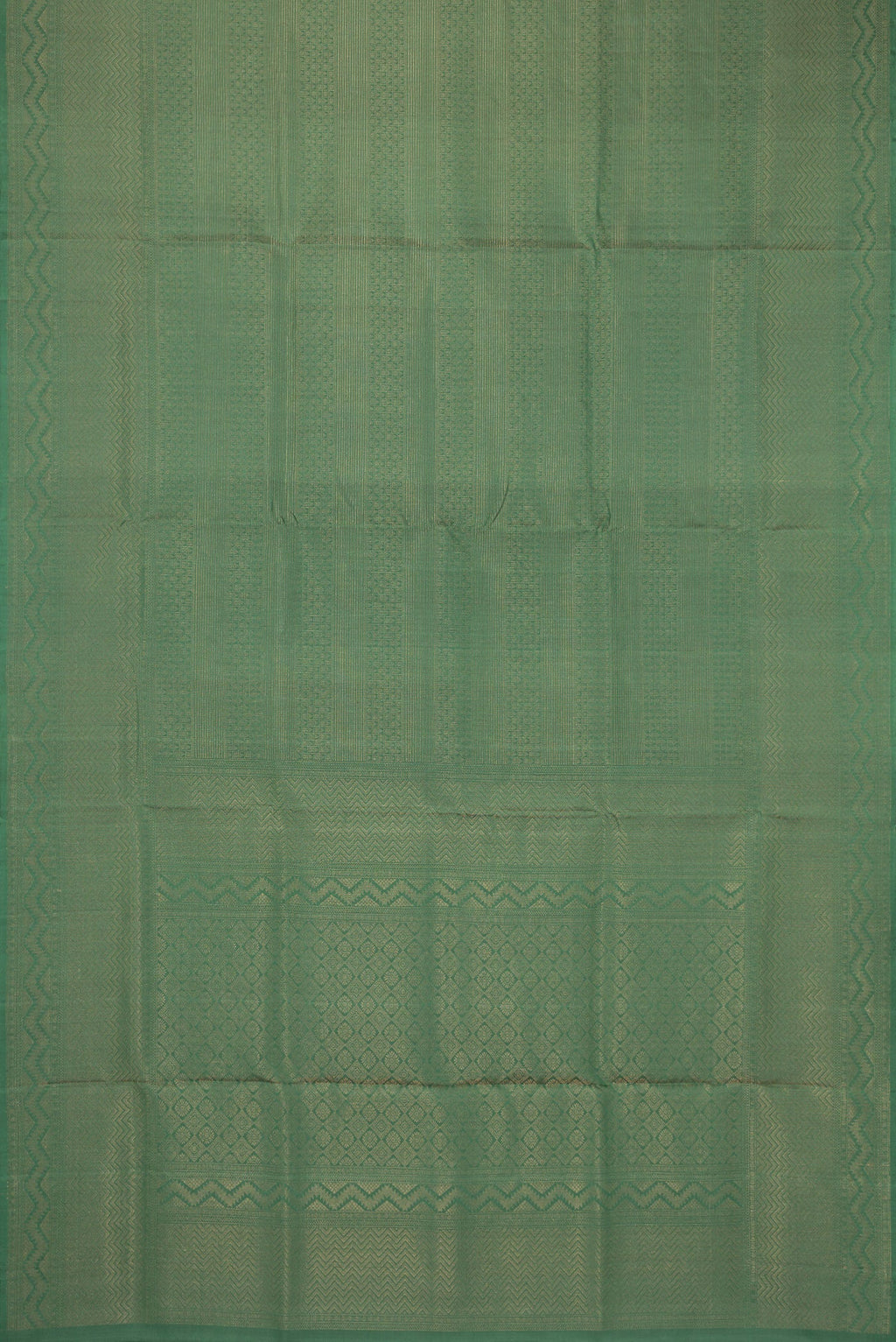 Flat view of Green Soft Silk Saree with Zari Brocade on the body and Fancy Border. 