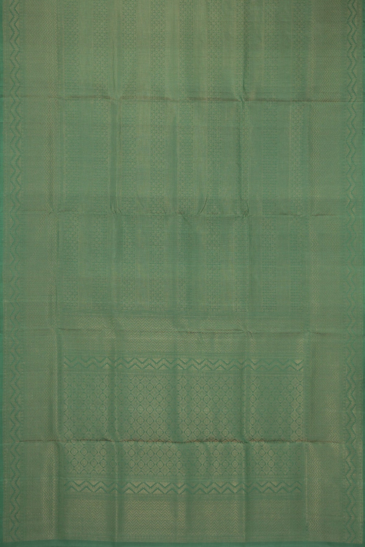 Flat view of Green Soft Silk Saree with Zari Brocade on the body and Fancy Border. 