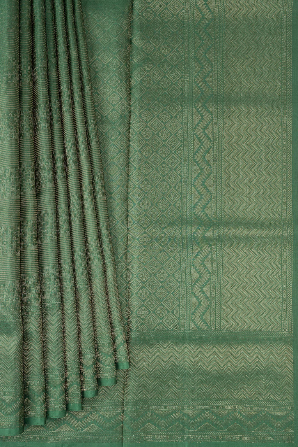 Pleats and pallu of Green Soft Silk Saree with Zari Brocade on the body and Fancy Border. 