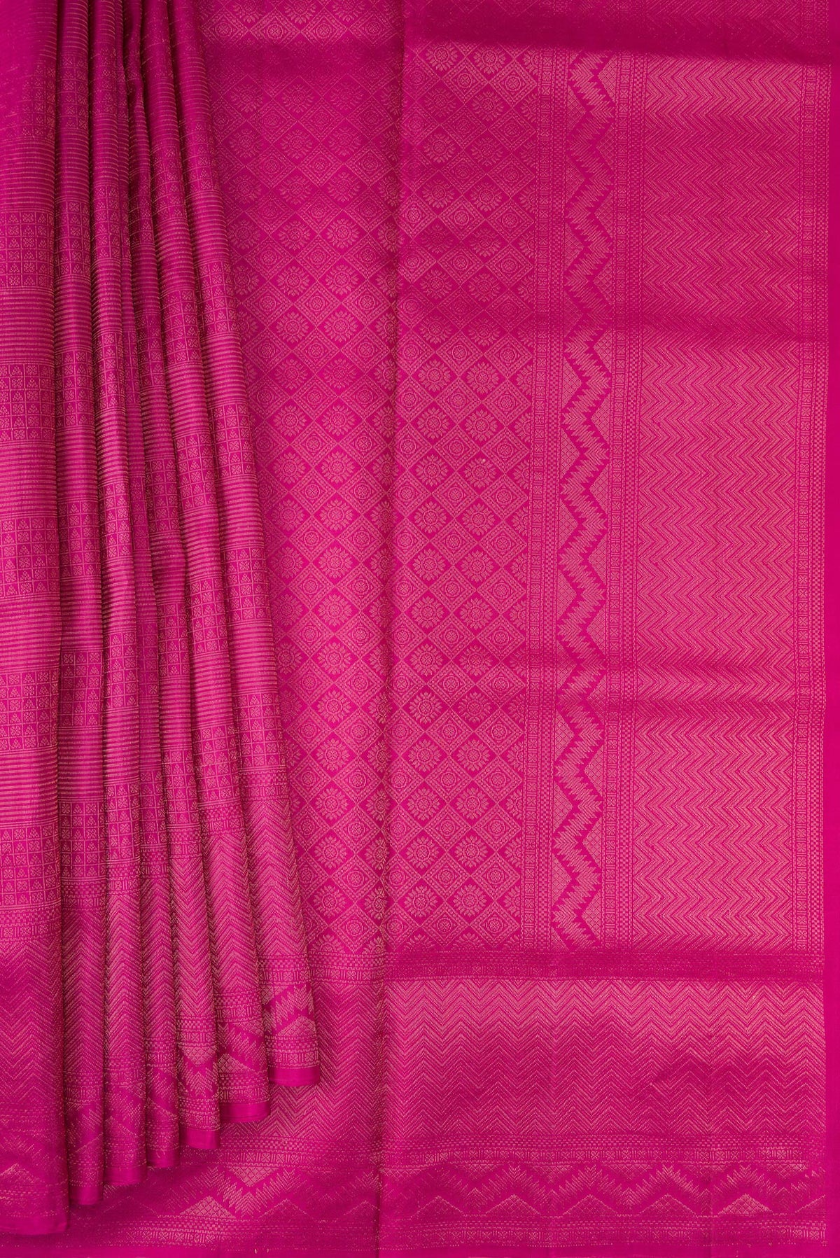 Pleats and pallu of Magenta Soft Silk Saree with Zari Brocade on the body and Fancy Border. 