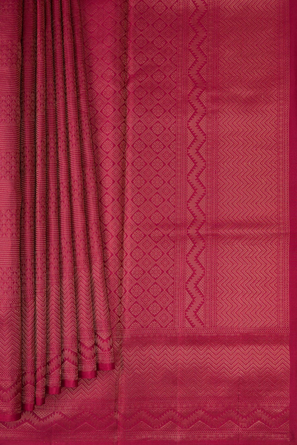 Pleats and pallu of Maroon Soft Silk Saree with Zari Brocade on the body and Fancy Border. 