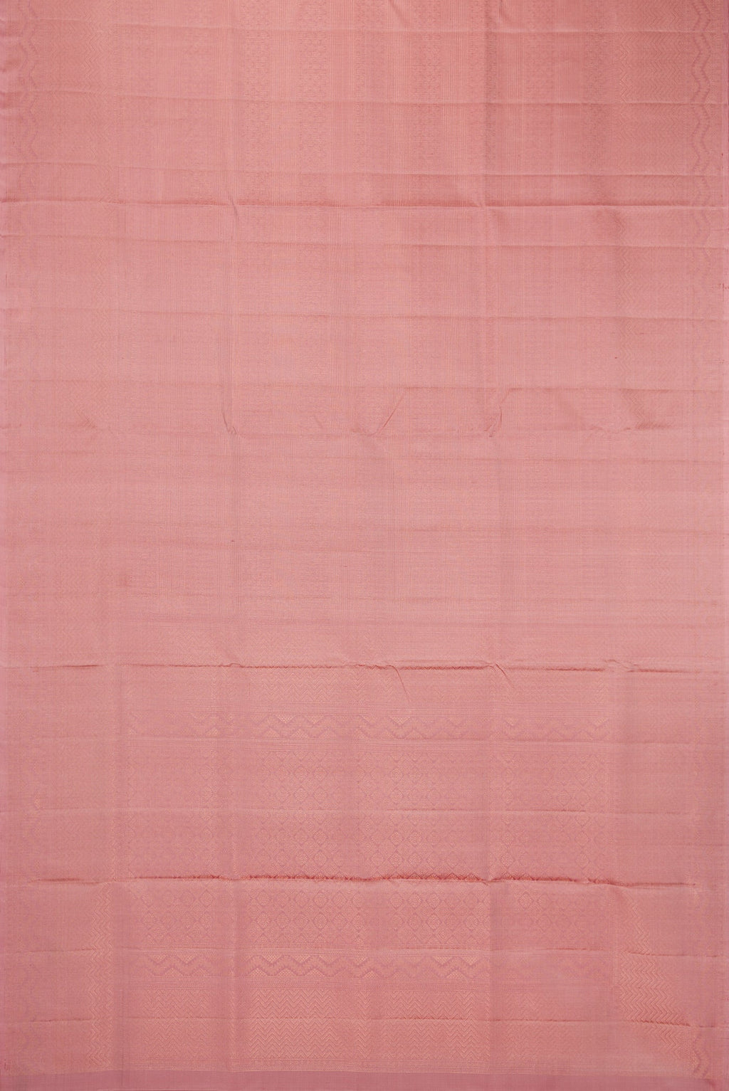 Flat view of Rose Gold Soft Silk Saree with Zari Brocade on the body and Fancy Border. 