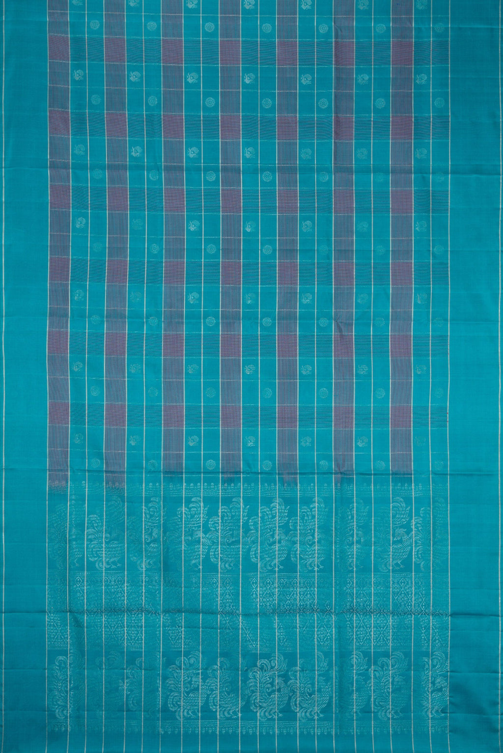 Flat view of Sky Blue Soft Silk Saree with Checked design on the body and Plain Border. 