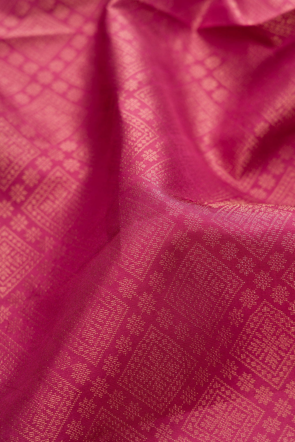 Close up of Pink Soft Silk Saree with Zari Brocade on the body and Fancy Border.  displaying folds
