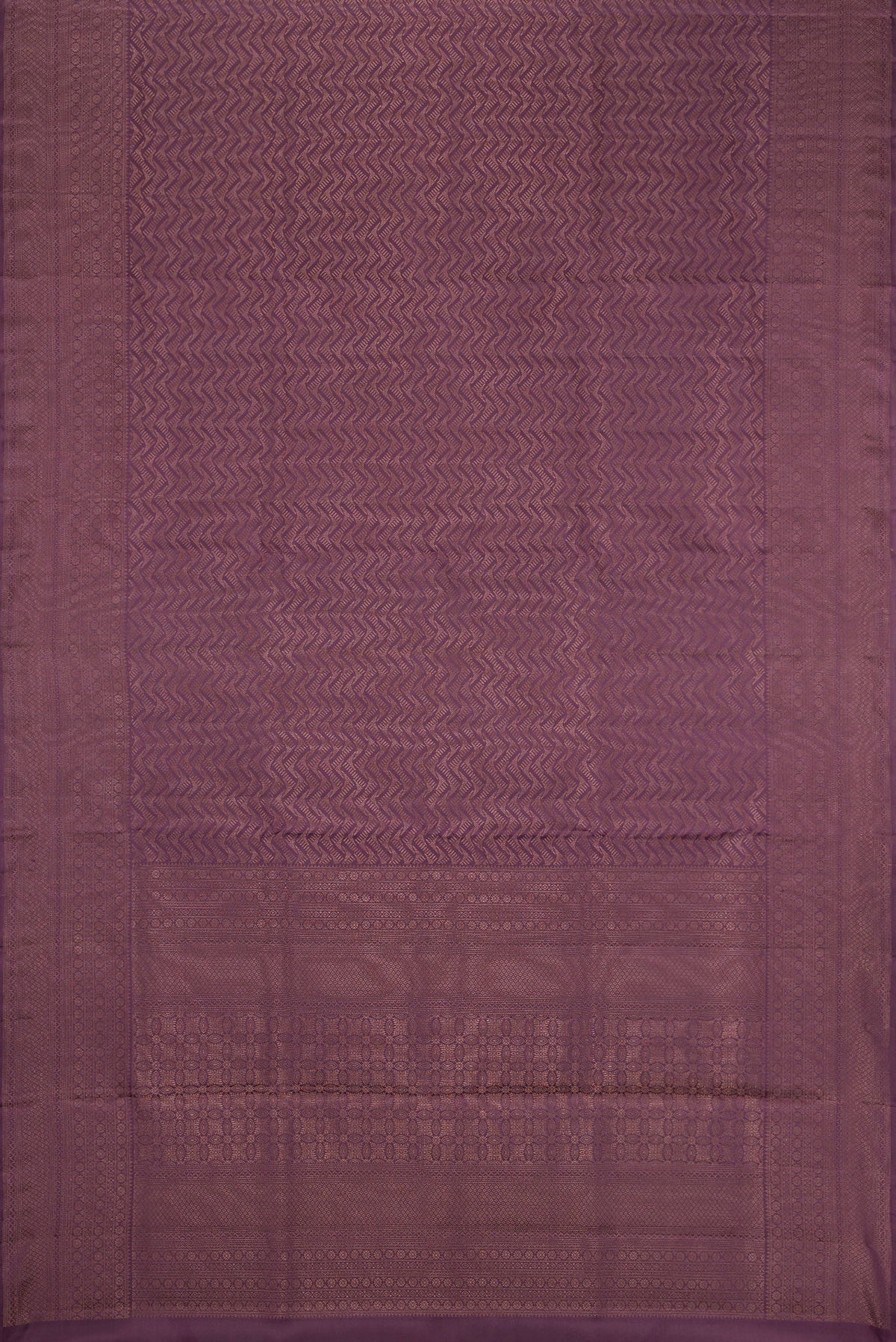 Flat view of Purple Soft Silk Saree with Zari Brocade on the body and Fancy Border. 