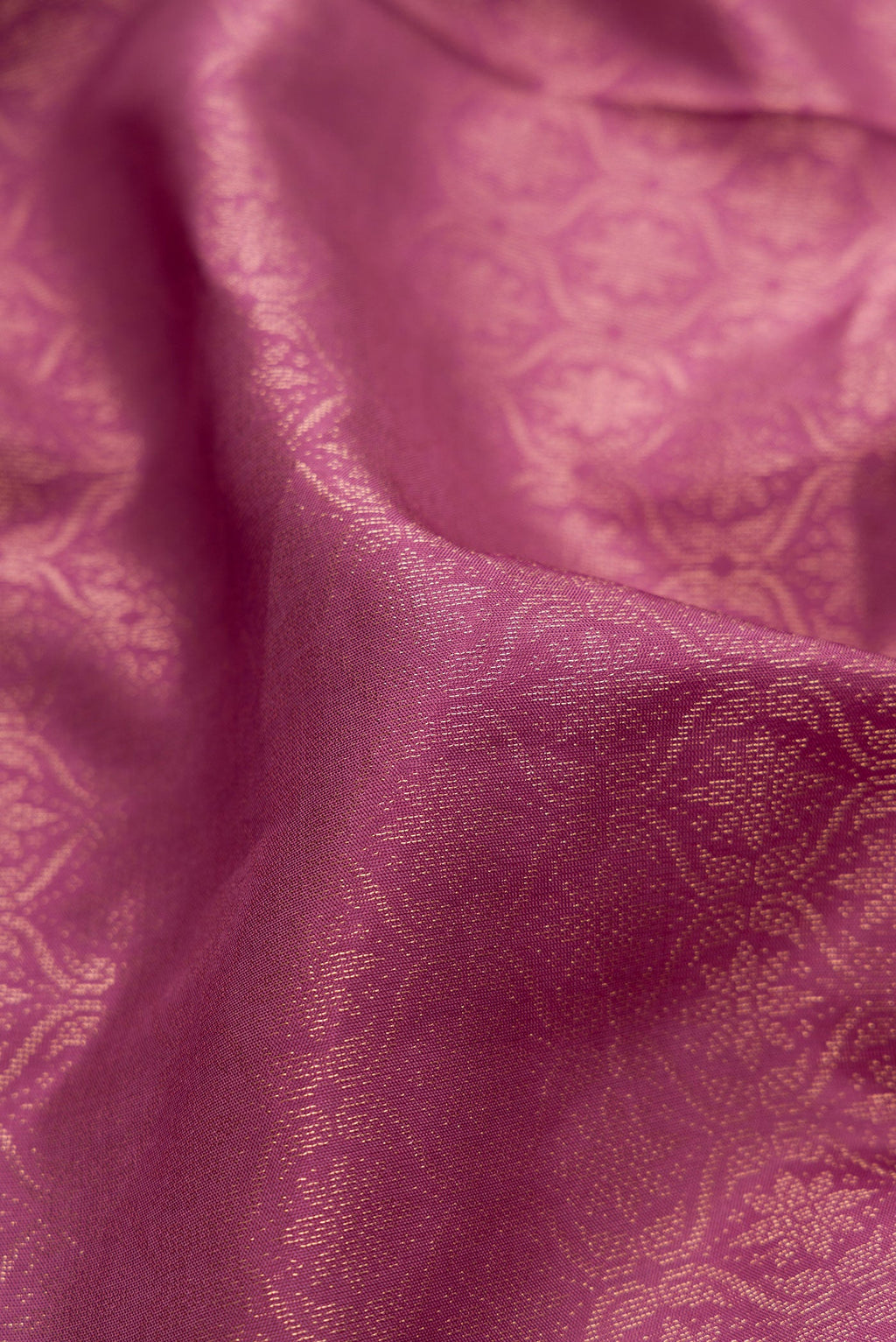 Close up of Lavender Soft Silk Saree with Zari Brocade on the body and Fancy Border.  displaying folds