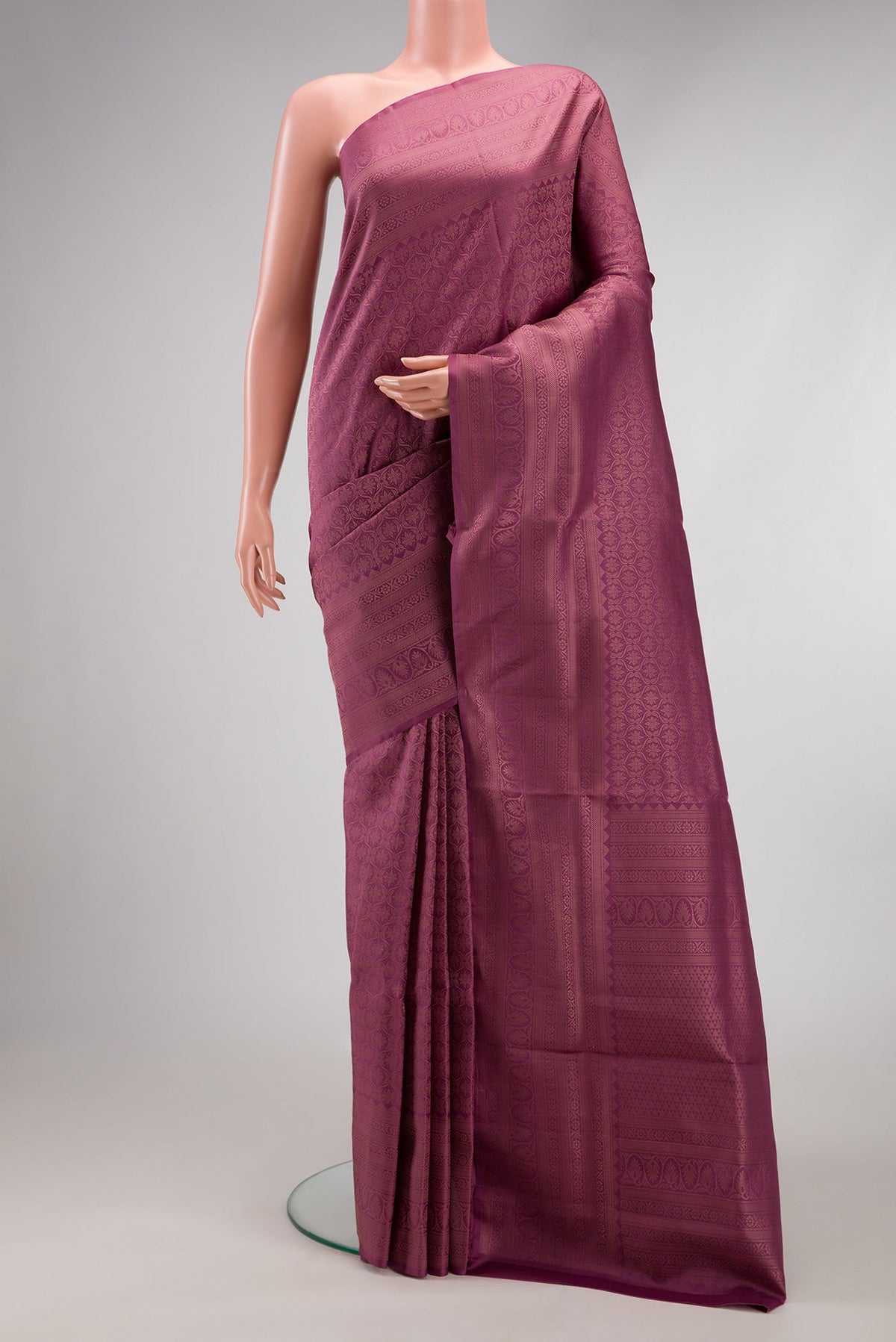 Lavender Soft Silk Saree with Zari Brocade on the body and Fancy Border.  displayed on a mannequin