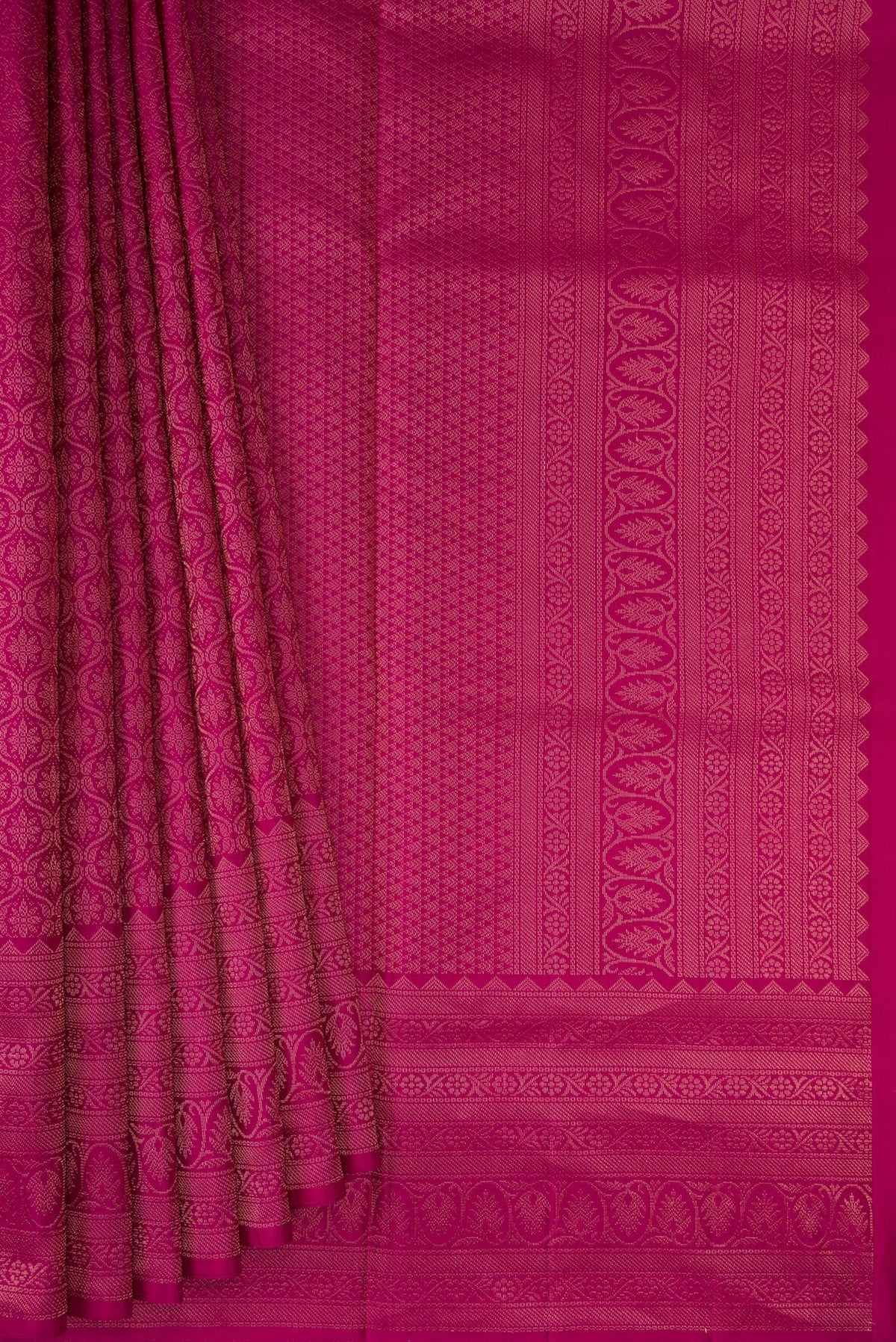 Pleats and pallu of Magenta Soft Silk Saree with Zari Brocade on the body and Fancy Border. 