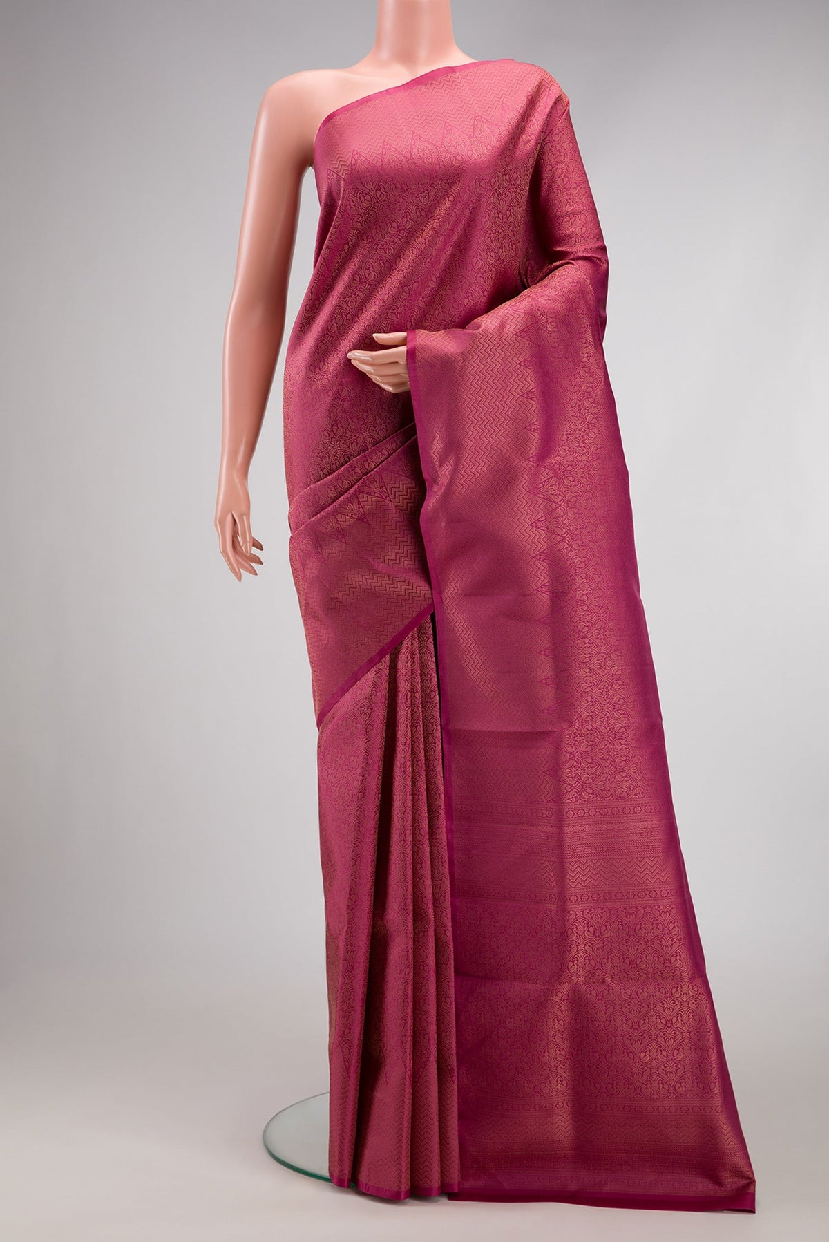 Dark Pink Soft Silk Saree with Zari Brocade on the body and Fancy Border.  displayed on a mannequin