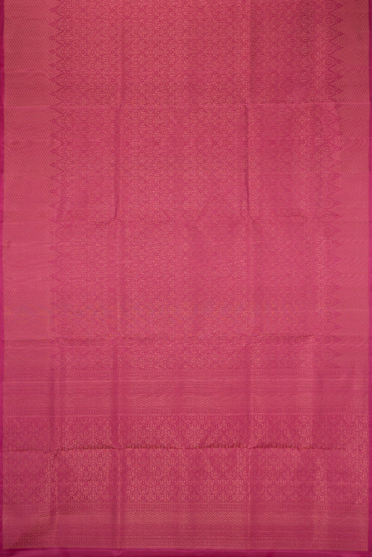 Flat view of Dark Pink Soft Silk Saree with Zari Brocade on the body and Fancy Border. 