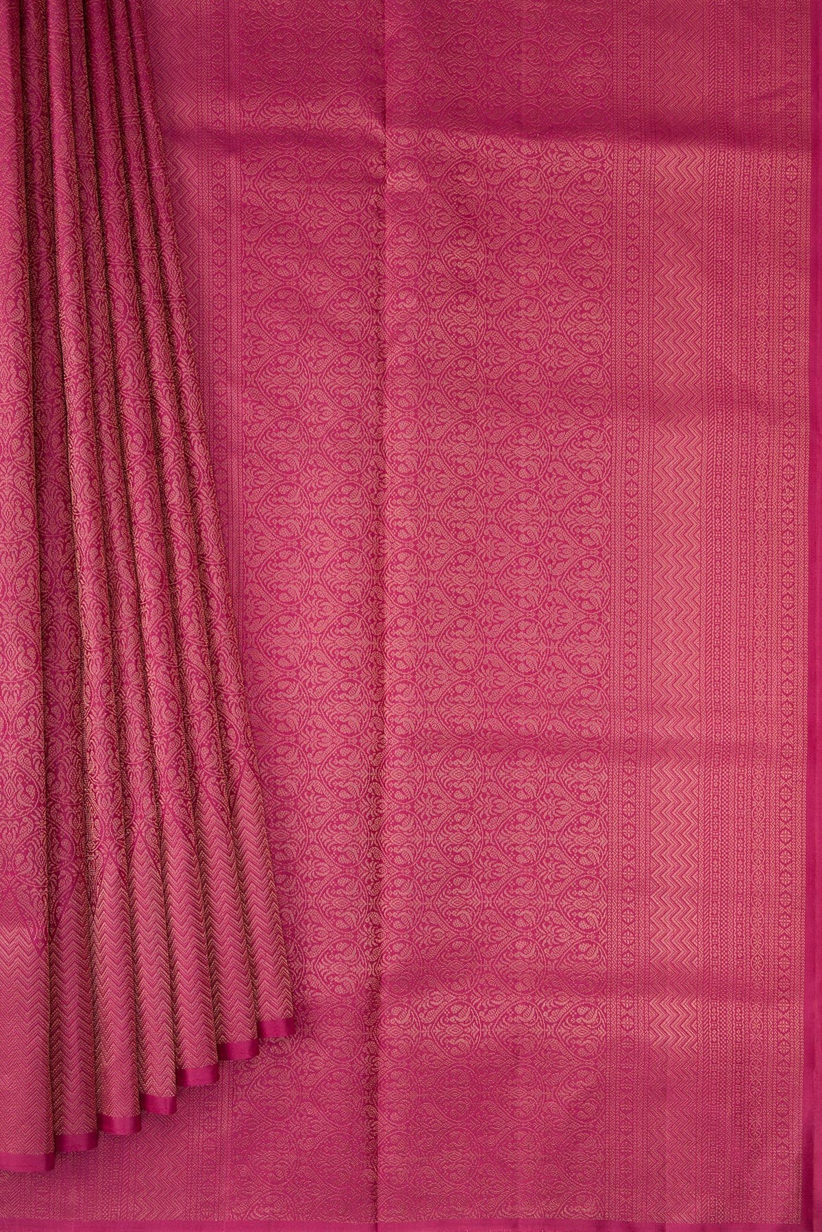 Pleats and pallu of Dark Pink Soft Silk Saree with Zari Brocade on the body and Fancy Border. 