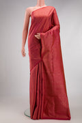 Coral Soft Silk Saree with Zari Brocade on the body and Fancy Border.  displayed on a mannequin