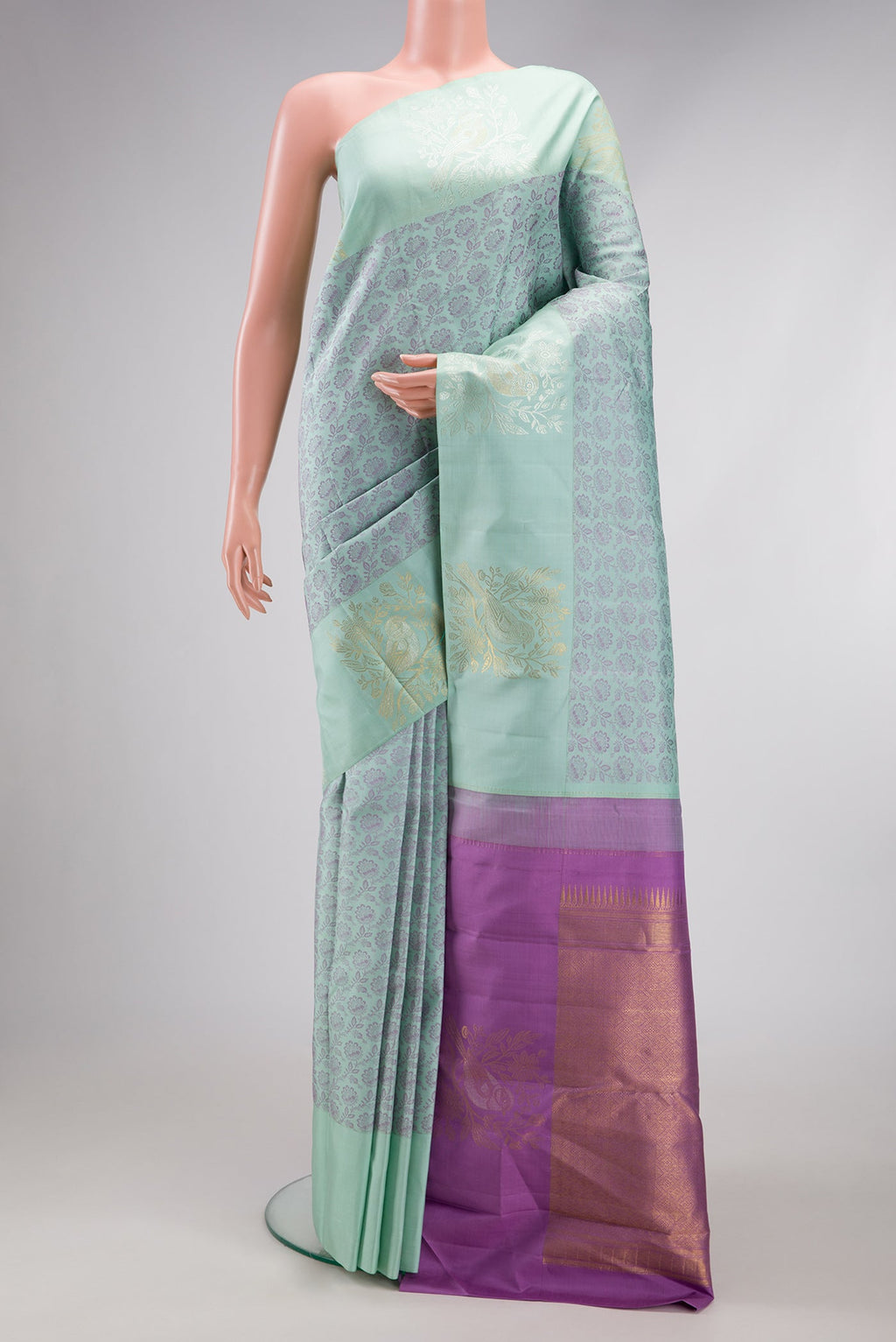 Light Blue Kanjivaram Silk Saree with Jacquard design on the body and Fancy Border.  displayed on a mannequin