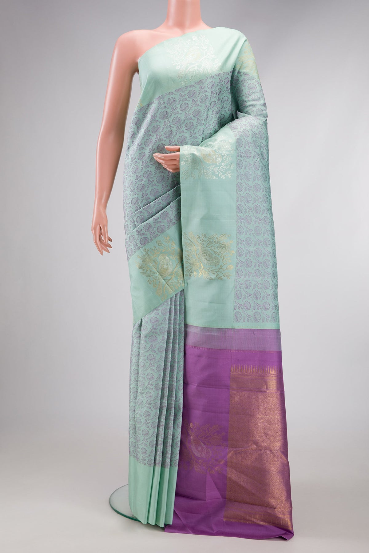 Light Blue Kanjivaram Silk Saree with Jacquard design on the body and Fancy Border.  displayed on a mannequin