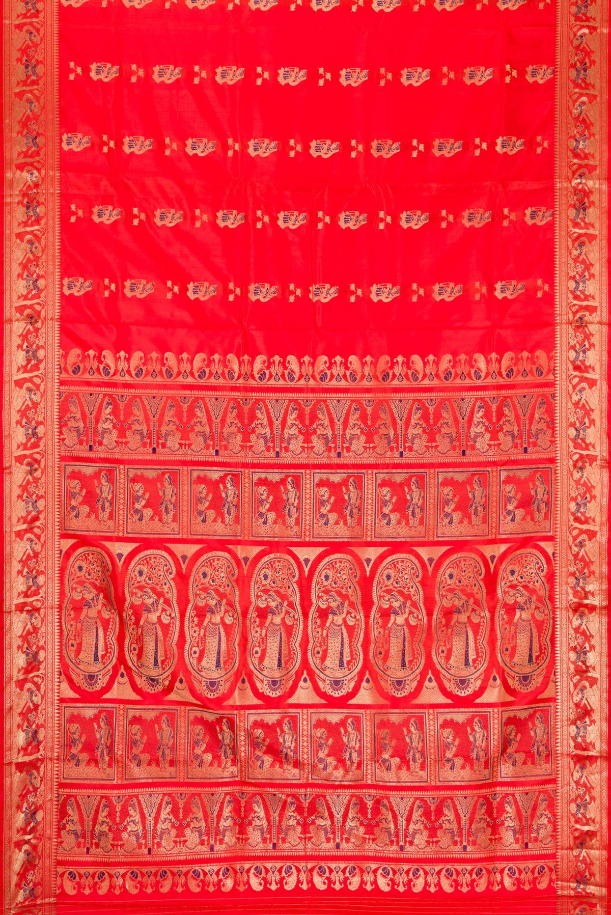 Flat view of Orange Baluchari Silk Saree with Zari And Thread Butta on the body and Fancy Border. 