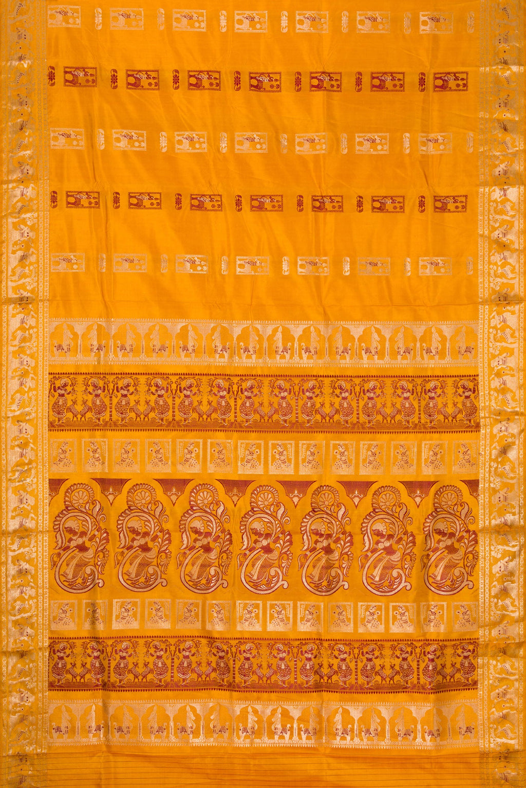Flat view of Mustard Baluchari Silk Saree with Zari And Thread Butta on the body and Zari Border. 