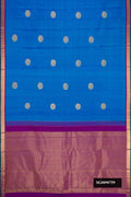 Sky Blue Kanchipuram Silk Saree with Zari Butta on the body and Zari Border.  displayed on a mannequin