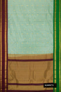Sea Green Dual Tone Kanchipuram Silk Saree with Zari Butta on the body and Ganga Jamuna Border.  displayed on a mannequin