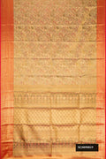 Gold Dual Tone Kanchipuram Tissue Silk Saree with Zari Brocade on the body and Zari Border.  displayed on a mannequin