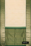 Sandal Dual Tone Kanchipuram Silk Saree with Zari Butta on the body and Zari Border.  displayed on a mannequin